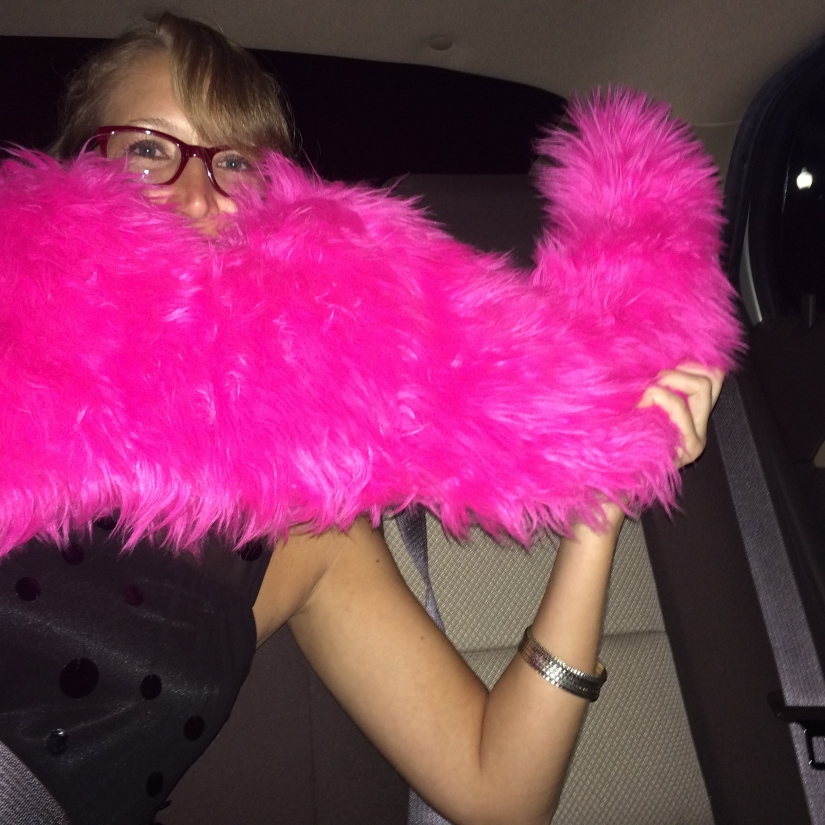 Me playing in the back seat of the Lyft car with the iconic Lyft mustache.